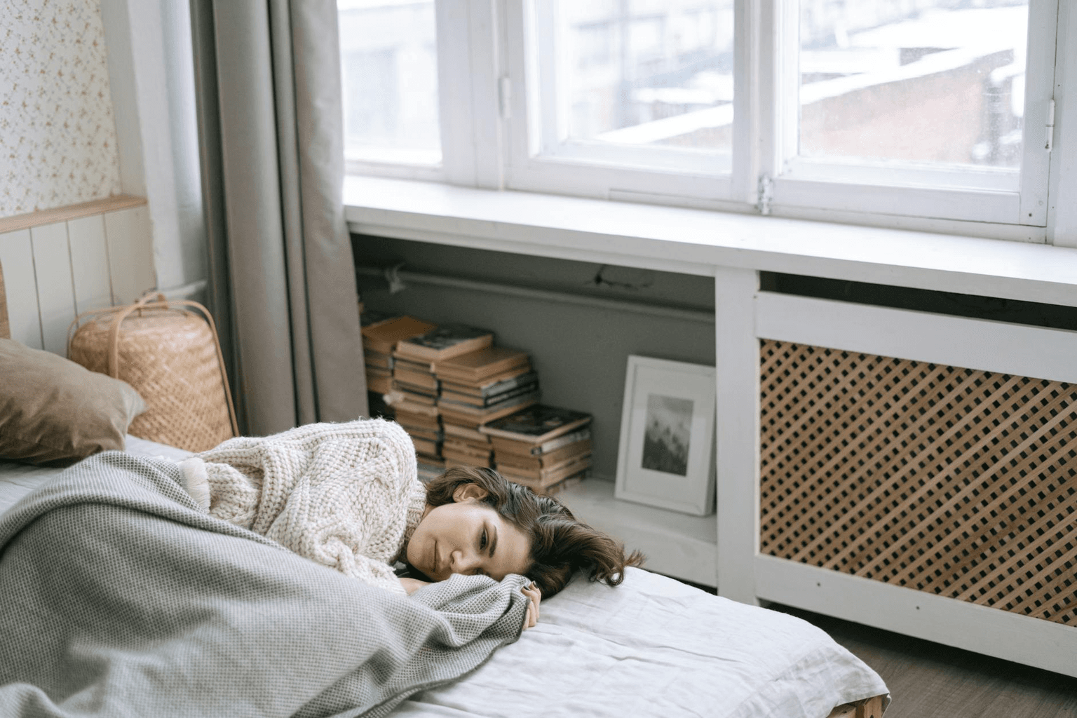 Soft morning light through window falling on a peaceful person resting, warm healing atmosphere for chronic illness recovery