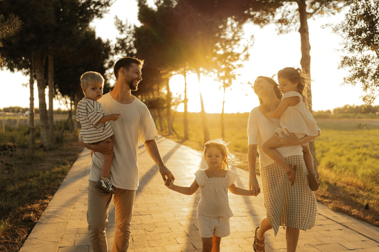 Happy children playing together in golden sunlight in a park representing joy, confidence, and childhood growth