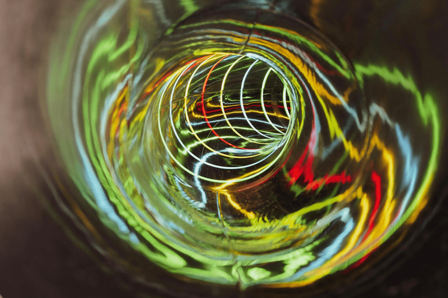 Swirling golden light spiral representing the vortex of high vibration and manifestation energy
