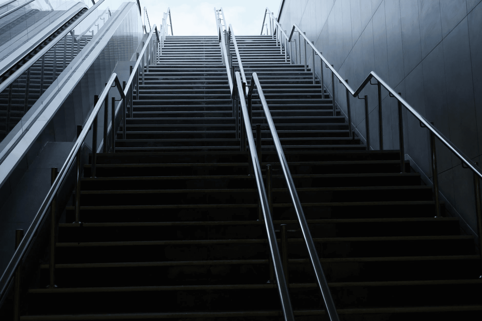 Staircase rising into golden light, representing five steps toward manifestation and goal achievement