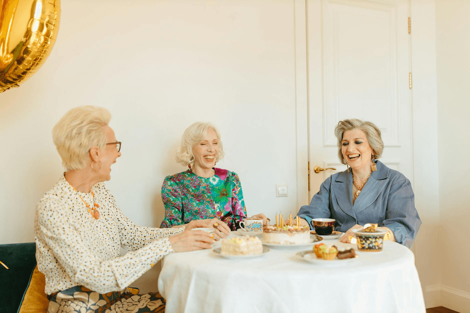 Group of friends laughing together in warm golden afternoon light