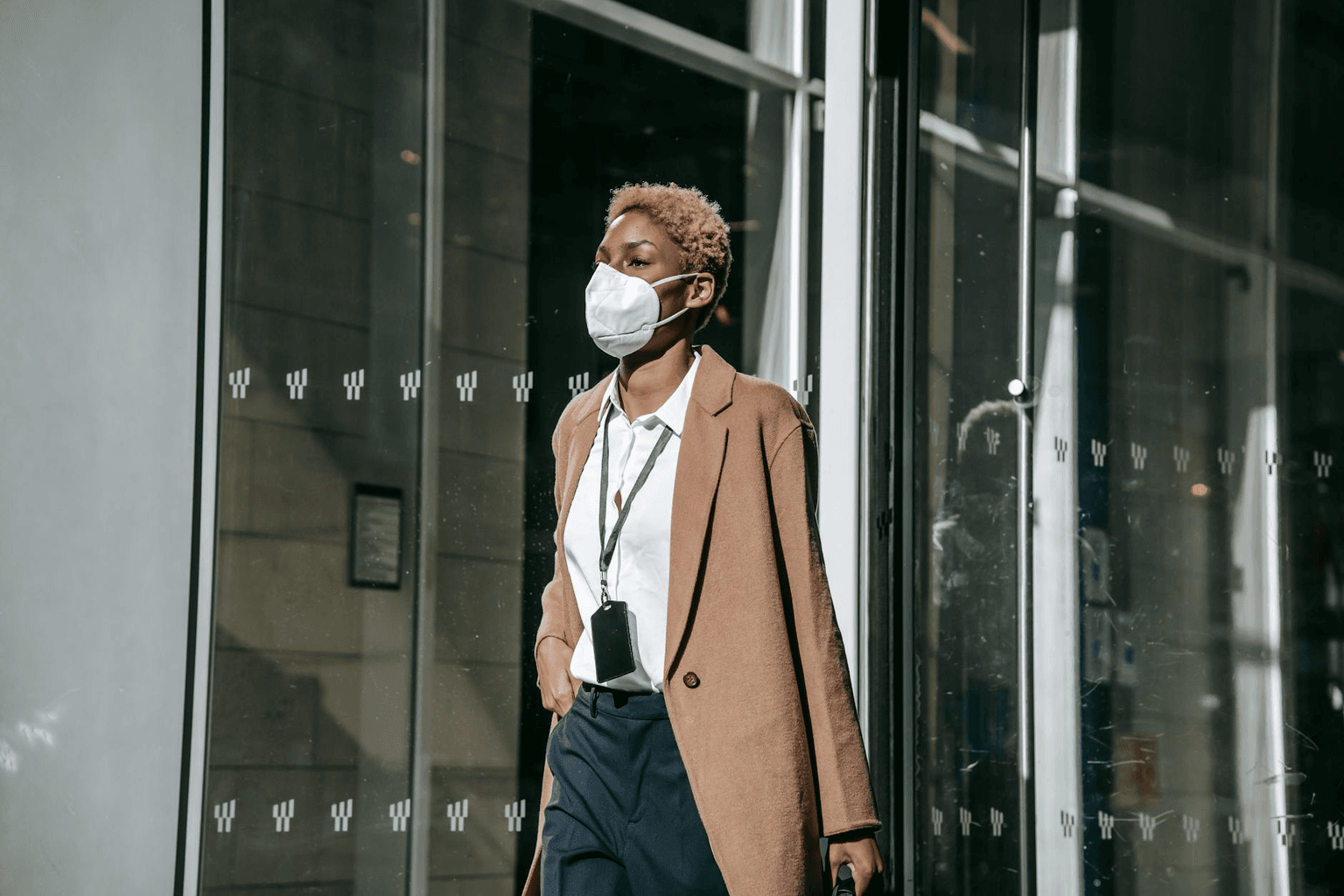 Person walking confidently away through golden light, magnetic and self-assured