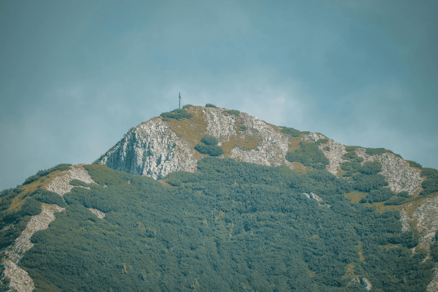 Sunrise over mountain peaks with a clear path ahead, representing a fresh year full of possibility and intention