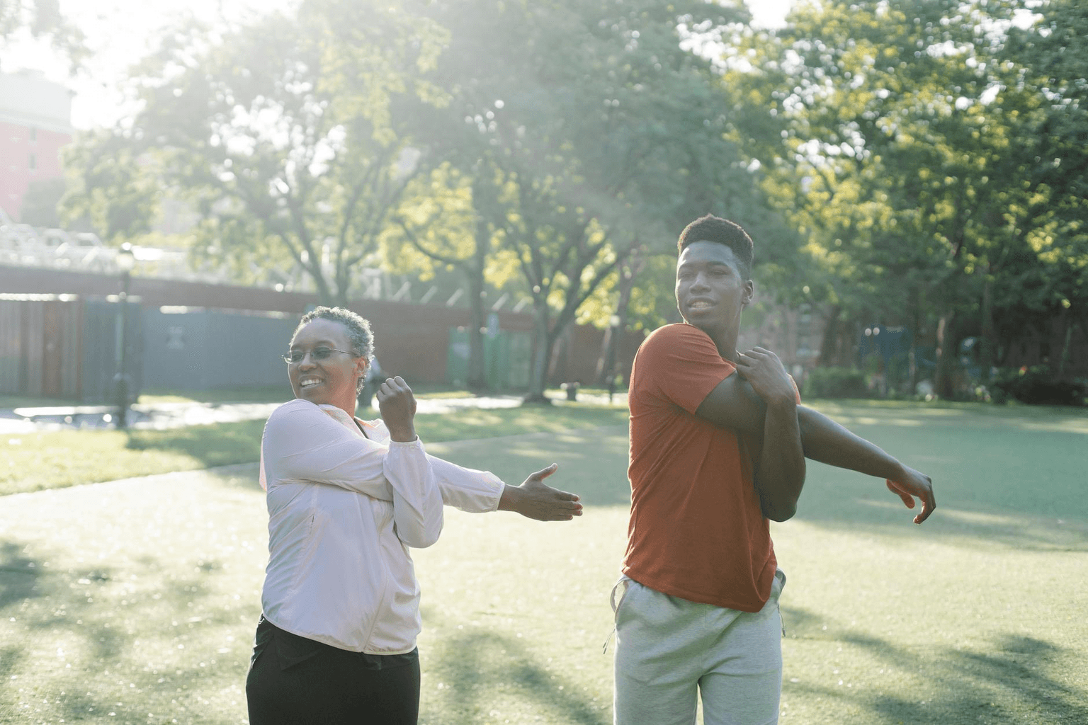 Person in morning light stretching with energy and vitality, representing ideal body manifestation and physical transformation