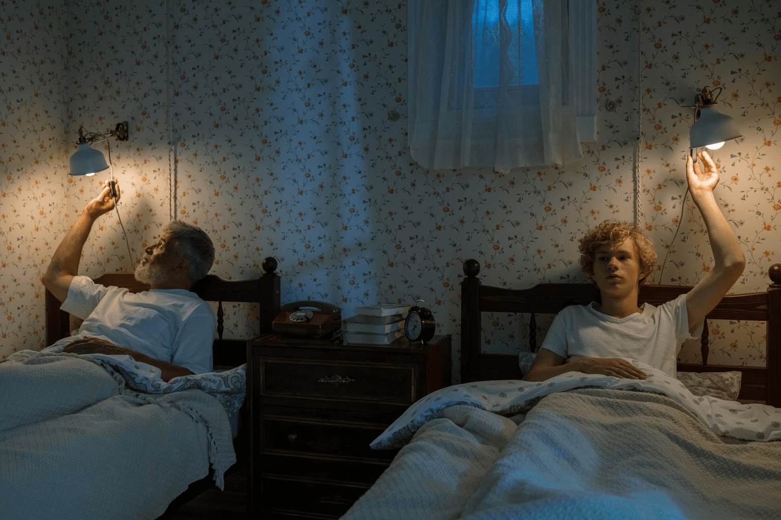 Peaceful bedroom at night with soft lamplight and a journal on the nightstand