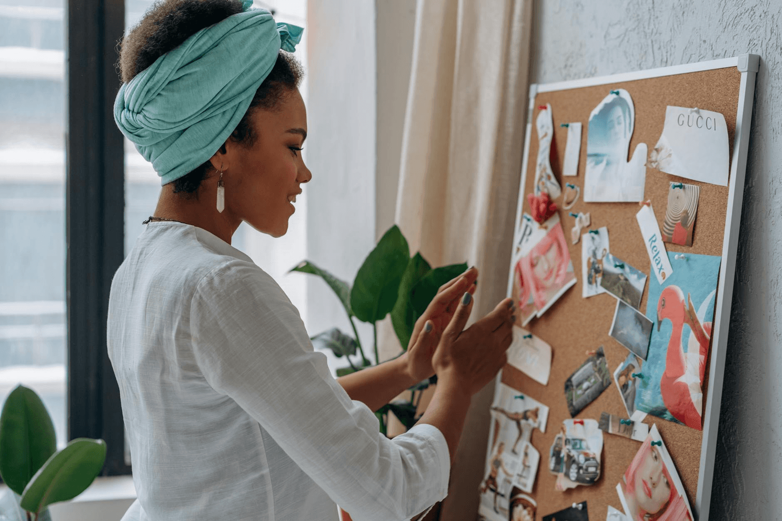 Beautiful vision board with inspiring images and golden text affirmations in warm morning light