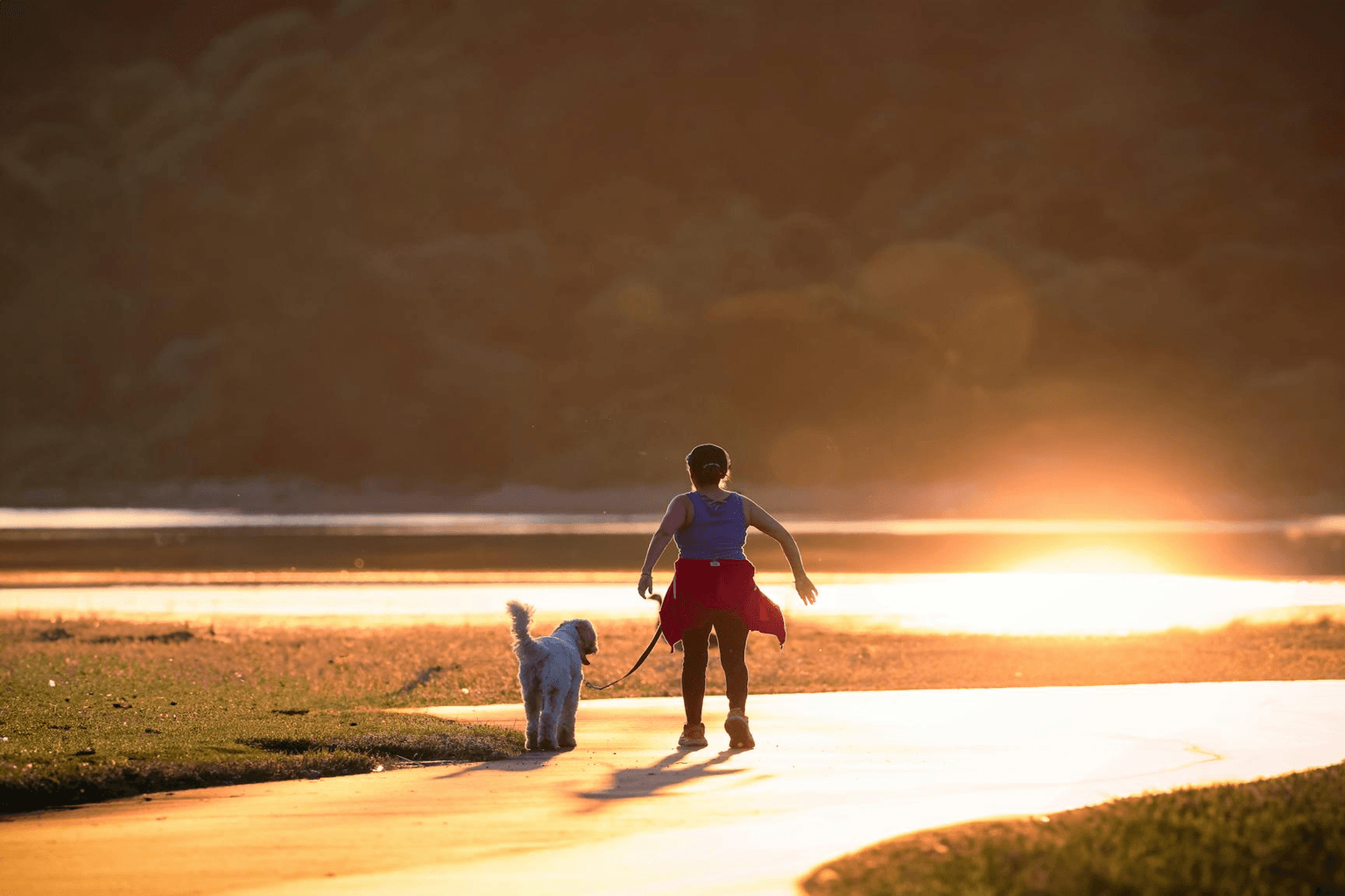 Person walking confidently in golden morning light representing body transformation and health identity